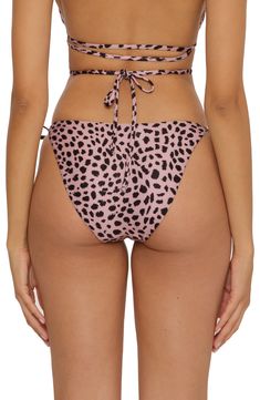 These fully adjustable bikini bottoms boast side ties and a bold print. Moderate back coverage Polyester/spandex Hand wash, line dry Imported Printed Tie-side Beachwear Bottoms, Pink Swimwear With Side Ties For Vacation, Beachwear Printed Tie-side Bottoms, Printed Tie-side Bottoms For Beach Season, Stretch Printed Tie-side Bottoms, Pink Swimwear With Side Ties, Printed Tie-side Pool Bottoms, Printed Tie-side Bottoms For Pool, Beachwear Swim Bottoms With Side Ties