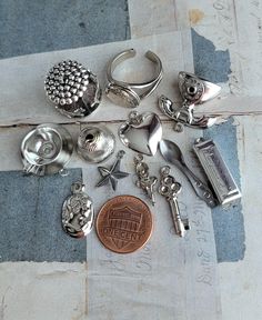 12 vintage silver-plate and silvertone charms including a locket ring and spinning carousel. Please expect minor aging/shelf-wear and overall glorious character. You'd receive all 12 pieces  Thank you for looking Pendant Locket, Locket Ring, Vintage Silverplate, Bling Bling, Carousel, Vintage Silver, Charm Pendant, Locket, Spinning