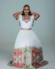 Indulge in the epitome of elegance with our breathtaking Habesha Kemis, a fusion of tradition and contemporary style. Our Habesha dress exudes timeless beauty and sophistication, adorned with intricate patterns that capture the essence of Ethiopian culture. White Ceremonial Dress With Zari Work, Ceremonial White Dress With Zari Work, Festive Hand Embellished Lehenga For Traditional Ceremonies, White Bollywood Dresses With Traditional Patterns, White Zari Work Dress For Traditional Ceremonies, White Dress With Zari Work For Traditional Ceremonies, Elegant Ceremonial Dress With Pallu, Traditional White Dress With Fitted Bodice, Fitted Embroidered Dress With Traditional Patterns For Wedding