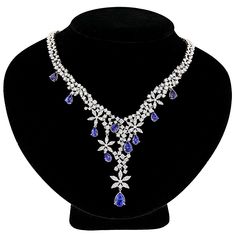 Designer Jewelry collection: This Diamond Tanzanite Chandelier Necklace in 18K Gold from our Luccello Jewelry collection is a very uniquely designed diamond necklace, weighs approximately 53 grams, featuring 11.13 carats of dazzling round diamonds and 9.66 carats of deep blue tanzanites, this luxurious diamond tanzanite necklace is simply irresistible. Bvlgari Necklace, Chandelier Necklace, Bulgari Jewelry, Designers Jewelry Collection, Tanzanite Necklace, Amazon Top, Simply Irresistible, Independent Consultant, My Team