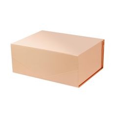 an open cardboard box sitting on top of a white surface with no one in it