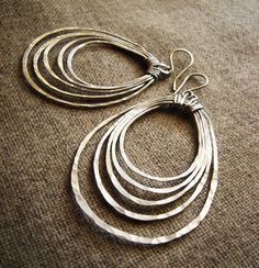 Potami // Hoop Earrings // Hand Forged, Hammered (Aluminum Silver) Concentric Oval Multi Hoop spring summer fashion by OneWorldTwoHands on Etsy https://www.etsy.com/listing/84584428/potami-hoop-earrings-hand-forged Aluminum Earrings, Aluminum Jewelry, Metalsmithing Jewelry, Mixed Metal Earrings, Festival Jewelry, Boho Festival, Metal Earrings, Light Weight Earrings, Hand Made Jewelry