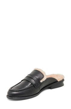 This luxe menswear-inspired loafer mule is lined with a cozy faux-fur lining that's sure to add a cozy element to your off-duty style. Synthetic upper/synthetic faux-fur lining/synthetic sole Imported Winter Shearling Slip-on Mules, Winter Leather Footbed Slip-on Mules, Casual Winter Shearling Mules, Chic Winter Slip-on Mules, Winter Shearling Mules, Winter Leather Mules With Cushioned Footbed, Winter Leather Slippers With Textured Sole, Winter Mules With Faux Fur Lining And Round Toe, Classic Winter Slip-on Loafers