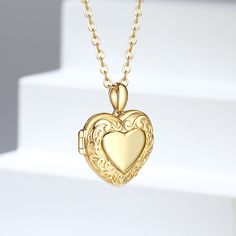 Step into a world where nostalgia meets modern elegance with our intricately designed locket necklace. Each side of this exquisite piece is a canvas for your cherished memories, allowing you to carry your loved ones with you wherever you go. The vintage-inspired floral patterns engraved on the locket evoke a sense of timeless beauty and sophistication, reminiscent of a bygone era filled with romance and grace. As you open the locket and gaze at the personalized photos inside, you are transported Personalized Vintage Heart Locket Necklace, Elegant Personalized Gold-plated Locket Necklace, Heart-shaped Gold Locket Necklace For Personalized Gift, Gold-toned Sterling Silver Locket Necklace For Personalized Gift, Sterling Silver Locket Necklace, Heart-shaped Vintage Locket Necklace For Memorials, Silver Locket Necklace, Sterling Silver Locket, Necklace Online