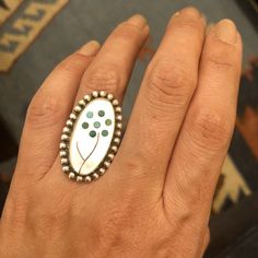 "Sterling Silver & Mother Of Pearl wildflower turquoise inlay Zuni ring. Size 8 It weighs 9 grams! Unique dainty ring, the stone is very pretty. Unsigned Ring face measures about 1 6/8\" tall by 14/16\" wide. A gorgeous piece to add to your fine collection!" Unique Turquoise Inlay Ring, Green Round Inlay Jewelry, Artisan Rings With Inlay For Anniversary, Bohemian Turquoise Ring With Inlay For Anniversary, Bohemian Turquoise Inlay Ring For Anniversary, Unique Green Inlay Rings, Unique Oval Rings With Inlay, Bohemian Inlay Jewelry For Anniversary, Sterling Silver White Inlay Ring