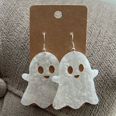 the ghost earrings are white and have brown eyes