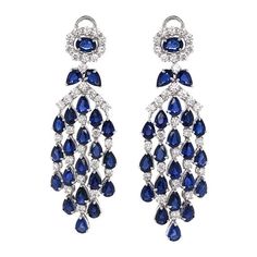 Dangling platinum earrings with pear and oval cut Ceylon sapphires 22.84 ct. Accent of small round white diamonds 4.69 ct. Diamonds are natural and in G-H Color Clarity VS. Platinum 950 Metal.  Omega / French clips. Width: 2.1 cm Height: 6.5 cm Weight: 27.4 g   #maxjewelryinc #jewelry #jewelries #sapphire #sapphires #earrings #accessories #fashion #earring #luxury #diamonds #diamond #bling Earring Luxury, Real Diamond Earrings, Diamond Chandelier Earrings, Blink Blink, Diamond Chandelier, Pear Earrings, Diamond Bling, Platinum Earrings, Hammered Hoop Earrings