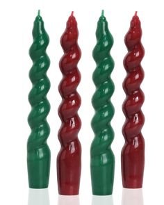 three green and red candles sitting next to each other