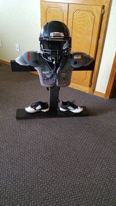 a hockey goalie's helmet sits on top of a pair of skis