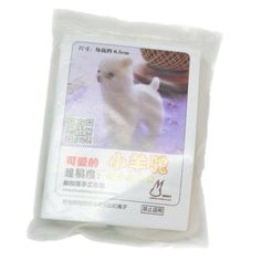 a small white dog in a plastic bag on a white surface with chinese characters written below it