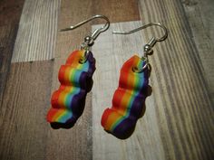 Rainbow Bacon Earrings Bacon measures approximately between 1.5cm to 2.25cm Materials: ▫ Polymer Clay ▫ Hypoallergenic Hanging Earring Hook Each bacon is handmade by me, so you may receive a pair of earrings that are slightly different from the ones pictured in the listing. As they are all made by hand all are similar but no two pairs will ever be the same! I can also do custom orders. Please feel free to send me a message with any questions or ideas! Thanks for checking out my shop! Rainbow Hypoallergenic Earrings As Gift, Rainbow Nickel-free Earrings For Gifts, Nickel-free Rainbow Earrings Gift, Nickel-free Rainbow Earrings For Gift, Adjustable Rainbow Earrings As Gift, Rainbow Single Earring As Gift, Single Rainbow Earring For Gift, Rainbow Polymer Clay Jewelry For Gifts, Bacon Earrings