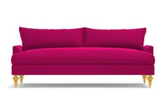 a bright pink couch with gold legs