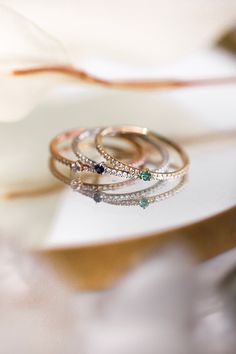 The Pavé Birthstone Stacker is a take on the CTWF classic Birthstone Stacker with a diamond twist. Stack your birthstone, anniversary stone, or a colored stone of your choosing along the pavé diamond band for a hint of sparkle and color. Diamond Stackable Rings For May Birthstone, Diamond Stackable Rings With May Birthstone, Round Emerald Ring With Pave Diamond Setting, Rose Gold Emerald Ring With Diamond, Diamond Birthstone Gemstones Round Cut, Round Diamond Birthstone Gemstones, Diamond Birthstone Gemstones, May Birthstone Diamond Ring In White Gold, Anniversary Diamond Gemstone For May Birthstone