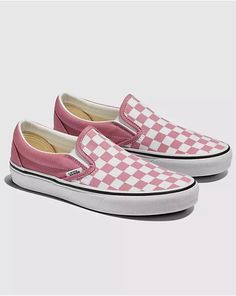 Introduced in 1977, the Vans #98, now known as the Classic Slip-On is a Southern California icon and everyday essential. This Checkerboard Classic Slip-On Shoe in Black/White includes a low profile canvas upper, supportive padded collar, elastic side accent, and out signature rubber waffle outsoles. Retro Pink Sneakers For Skateboarding, Classic Skate Shoes With Rubber Toe Cap, Retro Vans Skate Shoes With Rubber Waffle Outsoles, Retro Slip-on Sneakers For Streetwear, Slip-on Skate Shoes With Rubber Sole And Round Toe, Retro Pink Low-top Skate Shoes, Vans Retro Low-top Skate Shoes, Vintage Vans Low-top Sneakers, Vans Retro Skate Shoes With Contrast Sole