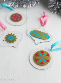 some ornaments are sitting on a white table