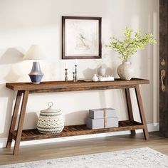 a wooden table sitting on top of a hard wood floor next to a white rug