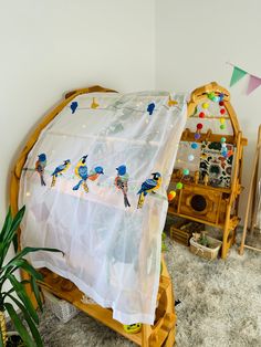 a room with a bed and some decorations on the wall next to a potted plant