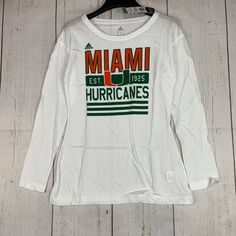 Miami Hurricanes Ncaa Adidas Small White Sweatshirt New Women Adidas Graphic Print Top For Sports Season, Adidas Tops With Graphic Print For Sports Season, Adidas Tops With Letter Print For Sports Season, Adidas White Sweatshirt With Letter Print, Adidas Logo Print Tops For Fall, White Adidas Sweatshirt With Letter Print, Adidas Long Sleeve Top With Logo Print, Adidas White Sweatshirt With Graphic Print, Adidas Tops With Graphic Print For Fall