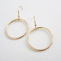 Dainty hoops hang from polished ear wires. ~choose from solid sterling silver OR 14K gold-filled // safe for most sensitive skin ~hoops measure about 15mm in diameter ~choose hammered or smooth finish >>To enter to my shop<< http://www.kgarnerdesigns.etsy.com Please contact me PRIOR TO PURCHASE if you are ordering on a deadline. I can usually accommodate quick shipping if I am made aware of your deadline. *Expedited shipping is available during checkout.* Most items are ready to ship Simple Design 14k Gold Earrings, Minimalist Gold-plated Circle Earrings, Minimalist Gold Plated Circle Earrings, Delicate 14k Gold Filled Hoop Earrings For Everyday, Delicate Gold Hoop Earrings For Everyday, Delicate Round Hoop Earrings For Everyday, Delicate Tarnish-resistant 14k Gold-filled Hoop Earrings, Minimalist 14k Gold Filled Circle Earrings, Dainty Yellow Gold Circular Earrings