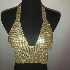 Material: Polyester Tops Type: Tank Tops Gender: Women Pattern Type: Patchwork Decoration: Hollow Out Clothing Length: Short Item Type: Tops Style: Sexy & Club Fabric Type: Broadcloth Gold Stretch Crop Top For Summer, Gold Stretch Crop Top, Gold V-neck Tank Top For Party, Fitted Gold Top For Festivals, Stretch Low-cut Party Tops, Fitted V-neck Tank Top For Festivals, Shiny Crop Top, Silver Tank Top, Metal Tank