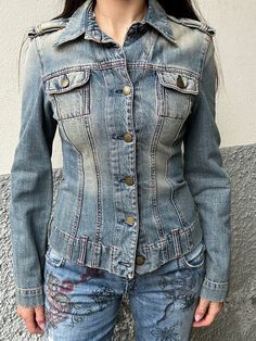 This 2000's denim jacket by iconic Miss Sixty is a stable in everyone's wardrobe. The fit is slim and the color a beige dusty light blue and green denim wash. Condition: this jacket is in a great pre owned condition with no remarks. Size: S Material: 100% cotton Important Information: All orders are shipped within 2-8 business days of purchase with Tracking. A notification email will be sent with tracking when the order has shipped. Once an item has been shipped, Juno Juno is not responsible for Fitted Long Sleeve Acid Wash Denim Jacket, 90s Style Washed Denim Jacket For Spring, Fitted Acid Wash Denim Jacket For Winter, Fitted Faded Cotton Outerwear, Vintage Fitted Light Wash Outerwear, Fitted Vintage Washed Blue Denim Jacket, Trendy Fitted Acid Wash Denim Jacket, Fitted Cotton Denim Jacket In Light Wash, Faded Fitted Denim Jacket