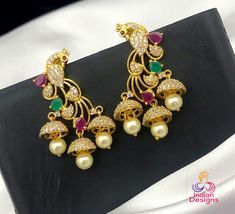 Beautiful party style multi layer designer Jhumkas with peacock design. Jhumka Earrings Gold, Emerald Blue, Blue Peacock, Ruby Emerald, Peacock Design, Kundan Necklaces, Jhumka Earrings, Cz Jewelry, Party Style