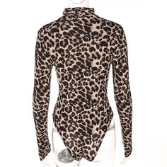 This simple yet stylish leopard print bodysuit is the perfect piece to pair with your pants, skirts, shorts, jeans or leggings. Made with a polyester & spandex blend you and featuring a mock turtleneck and long sleeves this bodysuit is is both stylish and comfortable.