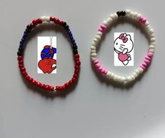 two bracelets with hello kitty designs on them, one is red and the other is white