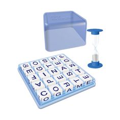 a blue and white computer keyboard next to a sand timer