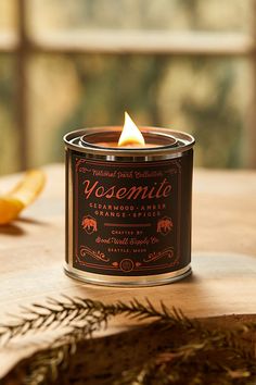 a candle sitting on top of a wooden table