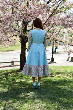 Our Storybook Farm Dress is simply dreamy! In gorgeous shades of aqua and mauve pink, it has a flattering empire bodice and is midi length with a sewn in petticoat. Fully lined and with contrasting trim throughout. Made from 100% cotton. Sewn in the U.S.A. Made in USA100% CottonFully LinedMidi DressBack Zipper3/4 Sleeve Pink And Blue Maternity Dress, Pink Cotton Dress With Intricate Embroidery, Blue Cotton Patchwork Dress, Pink Cotton Dress With Strawberry Print, Playful Pink Cotton Floral Dress, Shades Of Aqua, Farm Dress, Ponte Dress, Contrasting Trim