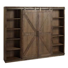 a large wooden bookcase with sliding doors