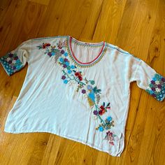 Beautiful Embroidered Johnny Was Top. Scoop Neck, 3/4 Sleeves, Notched Hem. Polyester. Machine Wash And Dry. New Without Tags. Bust: 28” Length: 26.5” Bohemian Tops With 3/4 Sleeve And Floral Embroidery, Summer Tops With Floral Embroidery And 3/4 Sleeve, Summer Floral Embroidery 3/4 Sleeve Tops, Bohemian Half-sleeve Blouse With Floral Embroidery, Bohemian Blouse With Floral Embroidery And Half Sleeves, Bohemian Half Sleeve Blouse With Floral Embroidery, Bohemian Top With Floral Embroidery And Half Sleeves, White Bohemian Half Sleeve Tops, Multicolor Embroidered Tops With 3/4 Sleeve