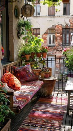 an outdoor patio with potted plants and rugs