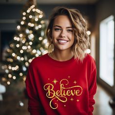 Believe Sweatshirt, Christmas T-shirt, Santa Gift Shirt, Christmas Lover T-shirt, Inspirational Shirt, Merry Christmas Gift T-shirt -----How To Order----- 1-) Please, check and review all photos 2-) Choose your t-shirt size and color *Different styles of shirts may have different shades of same color choice due to different manufacturer brands. *For this reason, we recommend you to match shirts from the same styles if you want precisely matching colors (exa. Unisex, V-neck, Tank top, etc.). 3-) Click add to cart. You can go back to add more product 4-)Click "Proceed to check out" 5-)When you check out, you can add a note to seller for any request. ---------- Product ---------- * 4.2 oz., 100% airlume combed and ringspun cotton, 32 singles. * Solid Colors:100% Airlume combed and ring-spun c New Year Holiday Crew Neck T-shirt, Festive Crew Neck T-shirt With Letter Print, Festive Letter Print Crew Neck T-shirt, Crew Neck T-shirt For New Year's Holiday, Red Christmas Sweatshirt Gift, Crew Neck T-shirt For New Year Holiday, Red Holiday Crew Neck T-shirt, Red Crew Neck T-shirt For Christmas, Holiday Red Crew Neck T-shirt