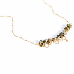 Delicate pyrite stones wrapped in gold chain. Necklace is 15" long. Can be lengthened upon request. Dainty Gold Crystal Necklace With Adjustable Chain, Elegant Bronze Wire Wrapped Necklaces, Dainty Gold Crystal Necklace Wire Wrapped, Gold Satellite Chain Jewelry, Dainty Gold Wire Wrapped Crystal Necklace, Gold Chain Necklace With Natural Stones For Gift, Gold Plated Jewelry With Natural Stones, Gold Wire-wrapped Metal Jewelry, Gold-plated Wire Wrapped Jewelry