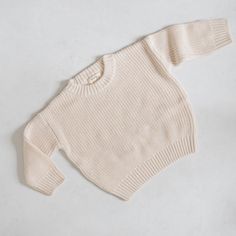 Oh, baby! This cable knit baby sweater has totally won us over. Oversized for a relaxed knit fit and reinforced with thick ribbed hemlines, our chunky knit baby sweater is a bon-a-fide dream come true. *THIS IS AN OVERSIZED KNIT SEATER IF YOU WANT A TTS FIT, SIZE DOWN 2 SIZES IF YOU WANT A BAGGY FIT, SIZE DOWN 1 SIZE IF YOU WANT A VERY LOOSE OVERSIZED FIT, STAY TRUE TO SIZE ** ALL SALE ITEMS ARE FINAL SALE Knit Baby Sweater, Bath Care, Oversized Knit Sweater, Knit Baby Sweaters, Sock Booties, Baby Sweater, Oversize Knit, Oversized Knitted Sweaters, Swim Sets