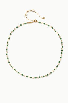 Classic and timeless, our Emerald gemstone beaded link chain necklace is all you need to add a pop of color to your everyday look. Perfect for layering, this necklace is your ideal companion for versatile styling options. Mix and match with other gemstone necklaces, chains and charms to stylize your own personalized look! Emerald: Success - Prosperity - Vitality Necklace Length: 14", 16", 18", 20", 24", 30" + 1" extender Gemstone Bead Size: 4 mm Cushion Cut Metal: Gold Vermeil Trendy Necklaces With Round Beads And Chain, Layering Beaded Necklaces With Adjustable Chain, Green Necklaces With Round Beads Chain, Everyday Green Beaded Necklaces, Everyday Green Beaded Chain Necklace, Green Necklaces With Delicate Chain And Round Beads, Crystal Necklaces With Delicate Chain And Round Beads, Gemstone Necklaces, Emerald Bead