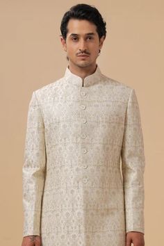 Shop for Raghavendra Rathore Blue Off White Raw Silk Flower Embroidered Achkan for Men Online at Aza Fashions Traditional White Embroidered Fabric For Formal Occasions, Designer White Fitted Traditional Wear, Designer Fitted White Traditional Wear, Fitted Sets With Intricate Embroidery And Stand Collar, Formal White Floral Embroidered Fabric, Designer Embroidered Brocade Sets, Designer Embroidered Cream Kurta, Ceremonial Embroidered Sets With Stand Collar, Fitted Embroidered Traditional Wear With Stand Collar