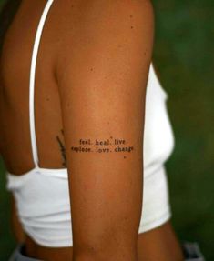 the back of a woman's arm with an inscription on it that says, i love