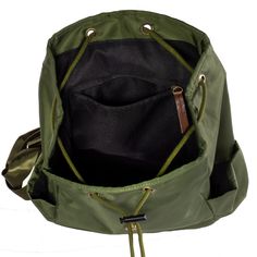 an open green backpack with zippers on it