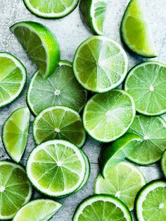 limes are cut in half on a table