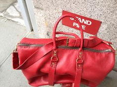 Red leather travel bag, Ladies duffle, Leather weekend bag, Custom luggage, Leather duffle bag, Red leather luggage, Travel duffle, NY made. More handmade leather travel bags, duffels, holdalls, carry alls, weekenders, overnight bags, weekend bags and luggage here: http://etsy.me/1eYE4hv About Leather This Red Leather is textured and thick but its more mailable than our standard leathers so it has a great relaxed look. But even though it has a less structured look the double leather bottom gives Red Travel Bag With Leather Handles, Red Leather Travel Bag For Everyday Use, Red Large Capacity Satchel Duffle Bag, Red Duffle Bag With Luggage Sleeve For Overnight Trips, Red Leather Travel Duffle Bag, Red Satchel Travel Bag, Red Leather Duffle Bag For Travel, Red Leather Duffle Bag For Everyday, Red Leather Luxury Travel Bag