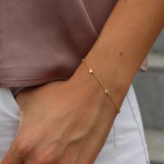 This beautiful silver Stars bracelet has an extender chain as adjusts to fit different wrist sizes. The length can go from 15 to 18cm. This dainty bracelet looks gorgeous stacked with other bracelets and watch. Simple, delicate and versatile... you'll want in your collection. D E T A I L S * Available in sterling silver or Crafted in Gold plated 925 sterling silver * Very easy to put on * An extender chain means it adjusts to fit different wrist sizes. - we use only the finest quality materials Dainty Adjustable Chain Bracelet With Star Charm, Elegant Sterling Silver Bracelets With Star Charm, Everyday Star Charm Bracelet, Adjustable Star-shaped Minimalist Bracelet, Dainty Silver Chain Bracelet With Star Charm, Dainty Star Charm Bracelet, Elegant Adjustable Charm Bracelet With Star Charm, Elegant Adjustable Chain Bracelet With Star Charm, Adjustable Delicate Jewelry With Star Charm