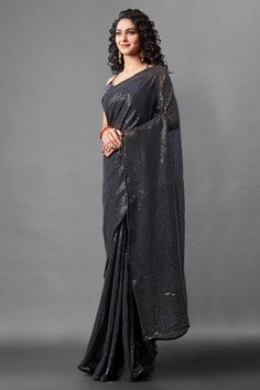 Attrective Look This Pretty Elegant Looking Designer Party Wear Saree In Black Color Paired With Blouse. This Saree Are Georgette And Blouse Are Banglori Silk Based With Designer Sequence Embroidery Work Beautified Saree. Buy Now.Product Features:  Saree Color: Black Blouse Color: Black Saree Fabric: Georgette Blouse Fabric: Banglori Silk Style Name: Designer Work: Sequence Embroidery, Piping Border Occasion: Partywear Size: Saree Length:-5.5 M Blouse Length:-0.80 M Wash Care: Dry Clean Disclaim Party Pre-draped Saree With Mirror Work In Art Silk, Festive Pre-draped Saree For Party Season, Bollywood Georgette Pre-draped Saree For Party, Evening Semi-stitched Traditional Wear For Navratri, Party Floor-length Art Silk Pre-draped Saree, Semi-stitched Saree For Wedding And Party Season, Festive Party Wear Pre-draped Embroidered Saree, Traditional Pre-draped Saree For Festive Party, Floor-length Sequin Fabric For Diwali