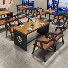 an empty restaurant with wooden tables and chairs