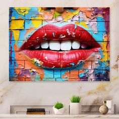 a painting on the wall of a woman's mouth with red lipstick and white teeth