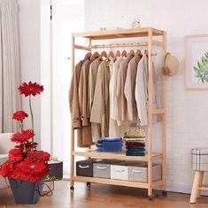 PRODUCT HIGHLIGHTS Product Title: Bamboo Standing Clothing Rack with Shelves Theme: Chic, minimalist Color: Wooden Hollow-out bottom for ventilation Easy to assemble Sturdy and long lasting SPECIFICATION Material: Bamboo Assembled Height: 66.3 inches (186.5 cm) Assembled Width: 31 inches (78.5 cm) Assembled Depth: 15.75 inches (40 cm) Weight: 6.4 kg * This product is only available in United States, Australia and France SKU 35022 Wood Clothing Rack, Wood Clothing, Rolling Clothes Rack, Bamboo Clothes, Heavy Duty Clothes Rack, Hanging Clothes Racks, Clothes Racks, Coat Rack Shelf, Wood Clothes