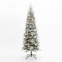 a white christmas tree with snow on it