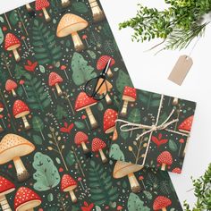 wrapping paper with mushrooms and trees on it